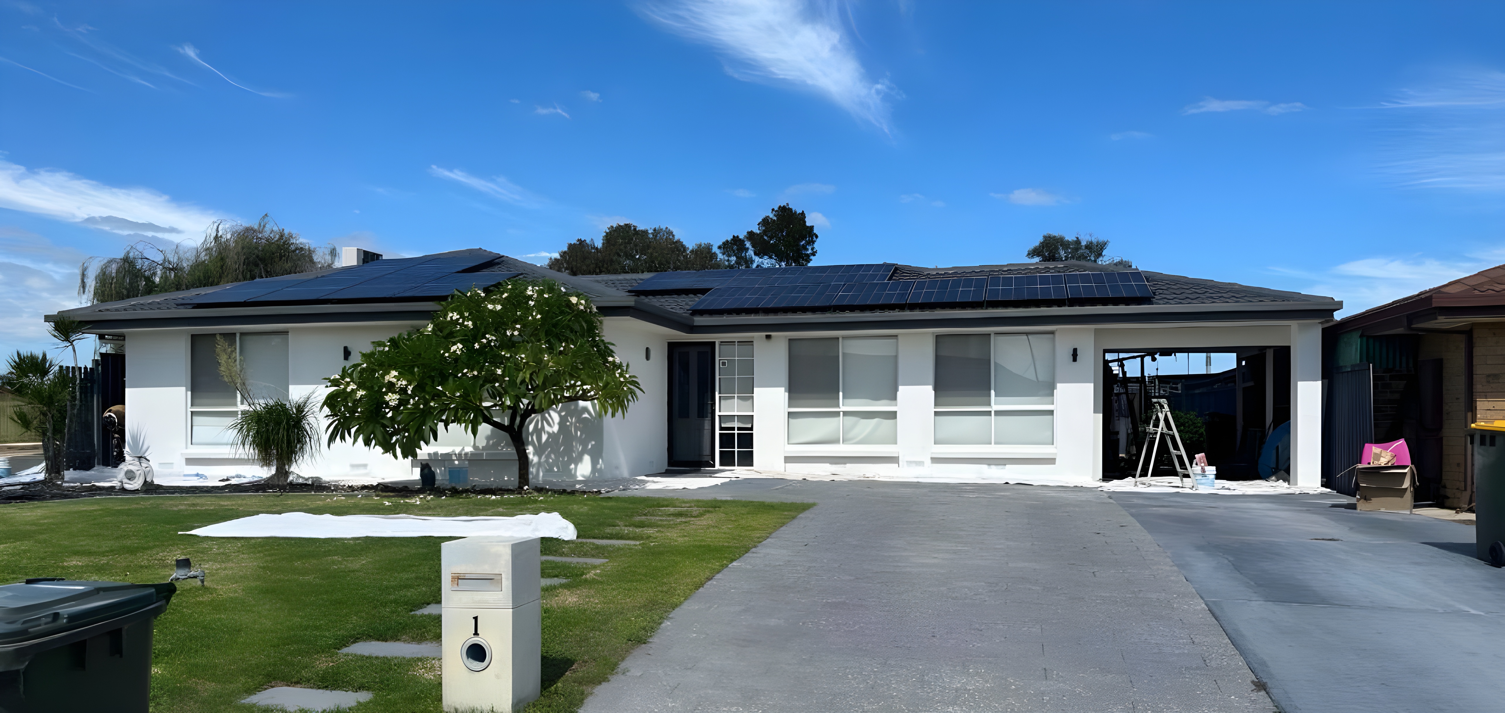 Freshly rendered home exterior with a clean white finish